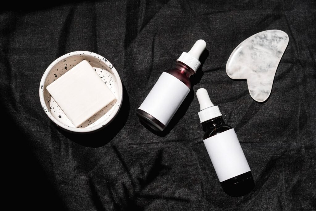 Several skincare serum and dropper bottles arranged together on a surface