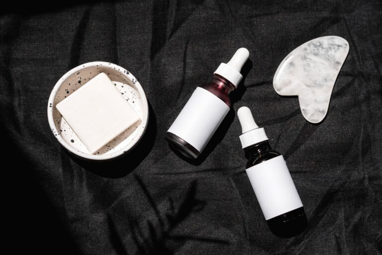 Several skincare serum and dropper bottles arranged together on a surface